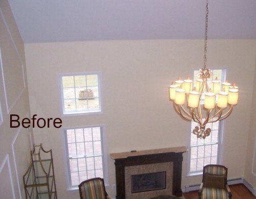 Before: Two story windows with no window treatments Before: Two story windows with no window treatments