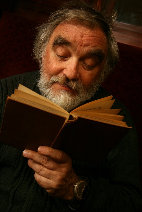 old man reading a book