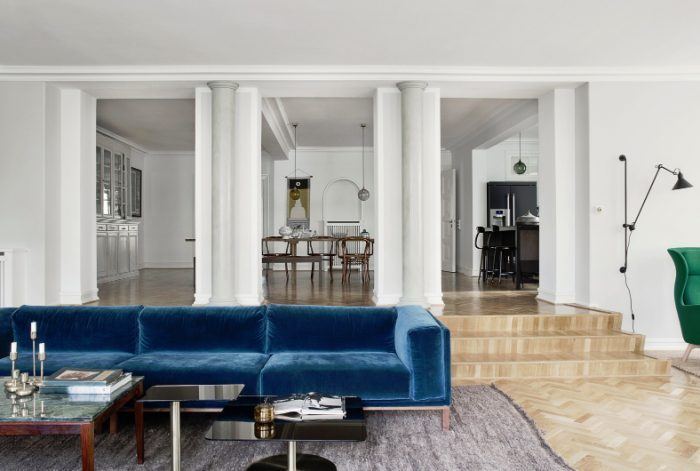 living room with blue velvet sofa