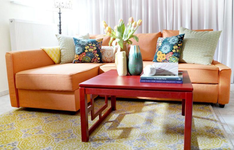 The Best Slipcovers For Any Sofa My Decorating Tips Blog L Shaped Sofa In Orange Slip Cover With Colorful Throwpillows Slipcover
