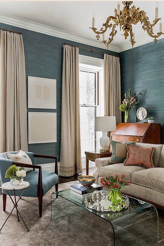living room with teal walls and beautiful furniture