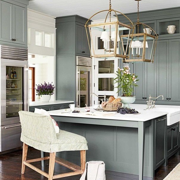 mixed metals lighting in green kitchen