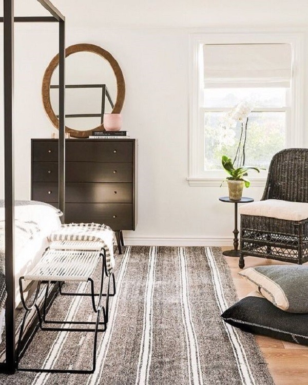 modern bedroom with black and white striped area rug