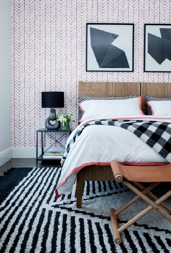 bedroom with wall art gallery above bed